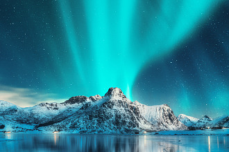 aurora-borealis-over-snowy-mountains-and-frozen